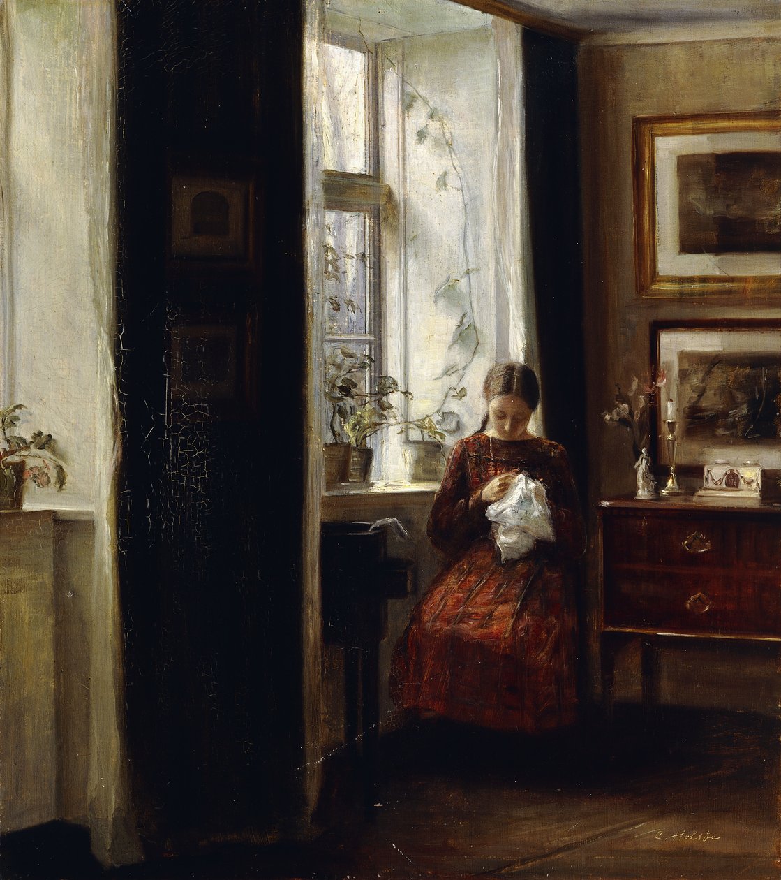 Ein junges Mädchen beim Nähen von Carl Holsoe