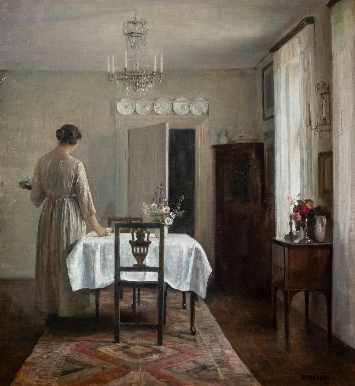 Die Frau des Künstlers deckt den Tisch von Carl Holsoe
