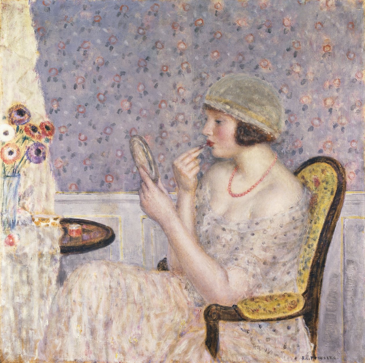 Frau an einem Schminktisch von Frederick Carl Frieseke