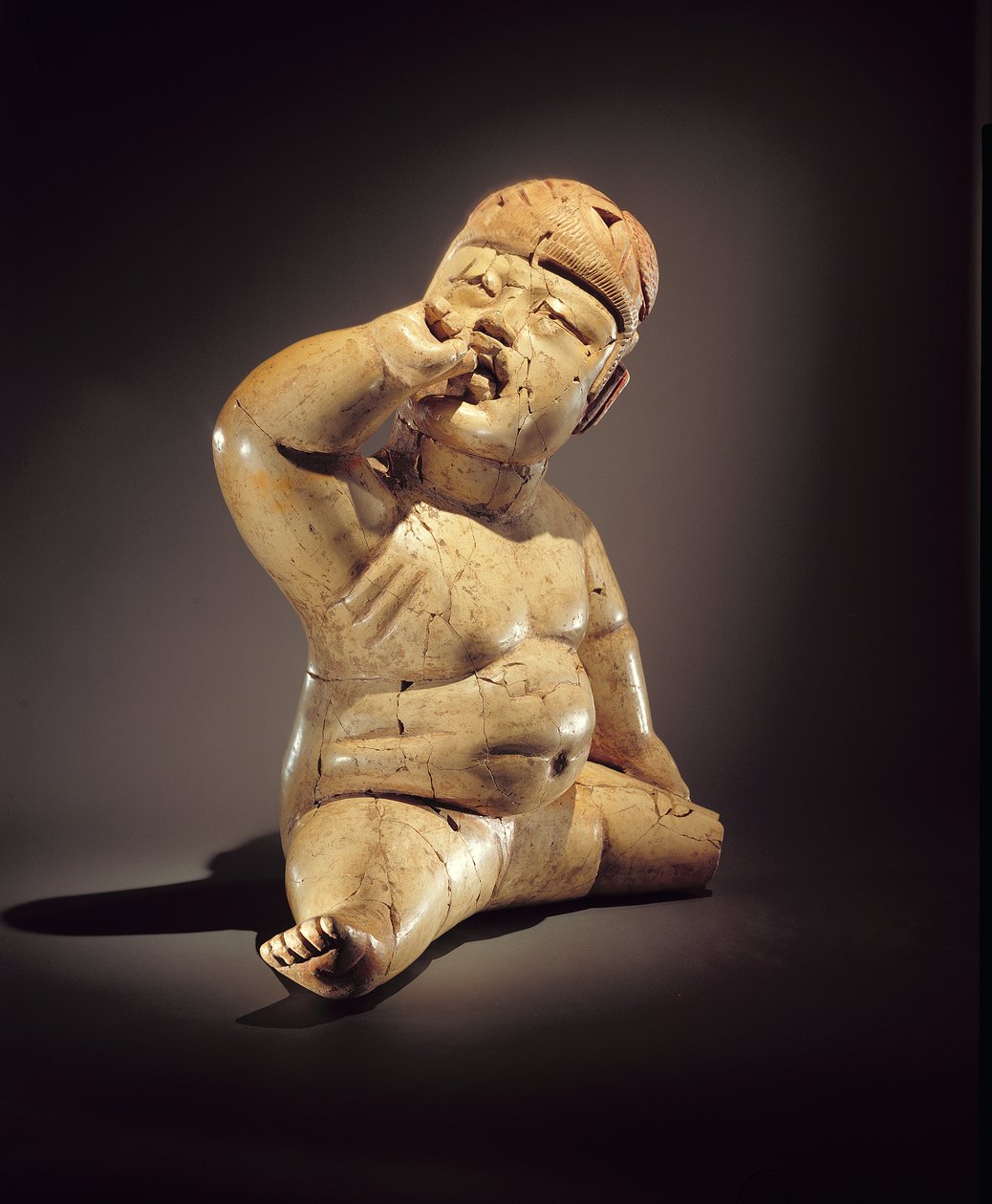 Babyfigur (Keramik, Zinnober und roter Ocker) von Olmec