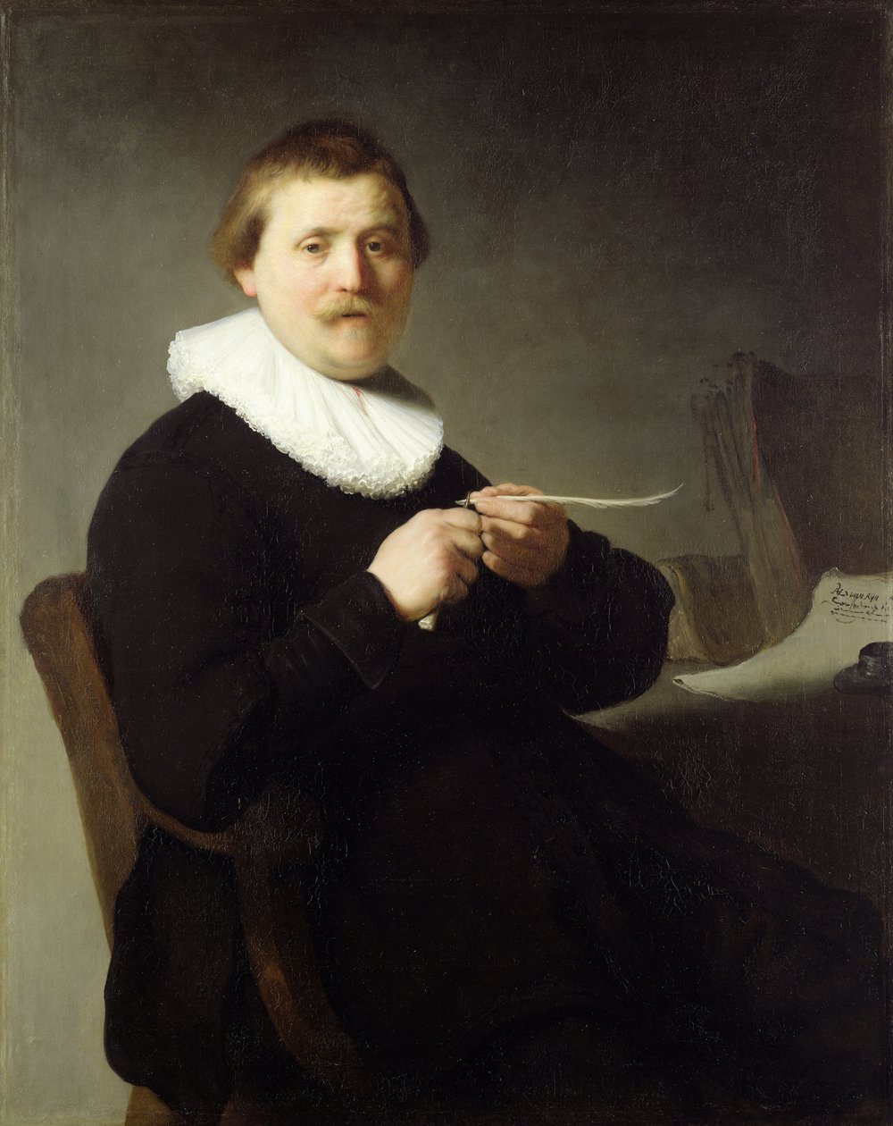 Mann, der eine Feder spitzt von Rembrandt van Rijn