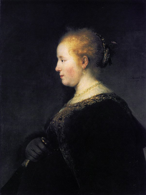 Junge Frau im Profil mit einem Fächer von Rembrandt van Rijn