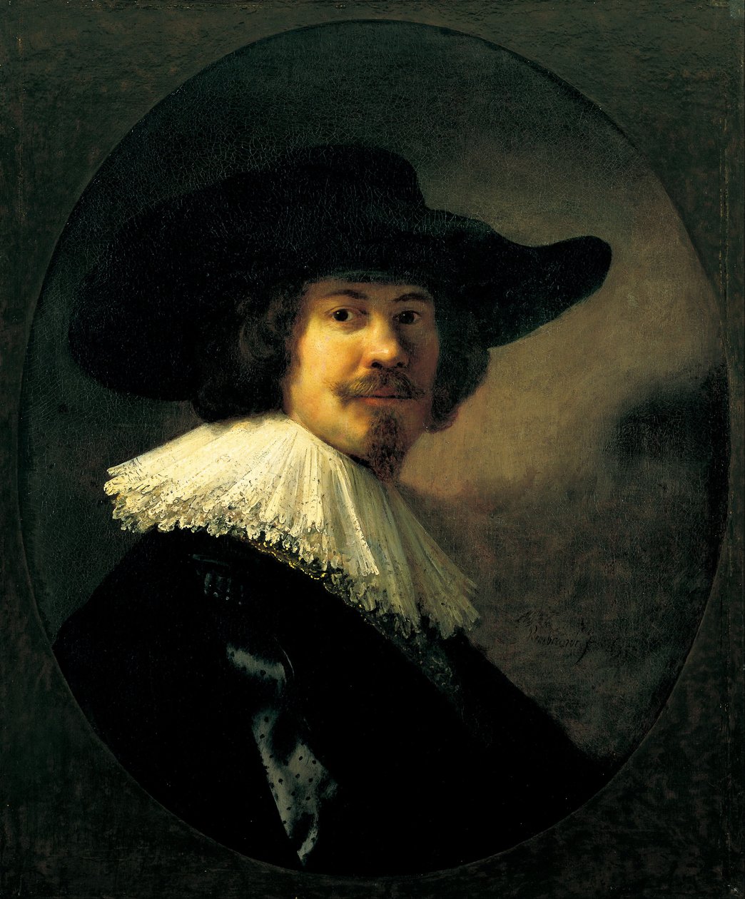 Porträt eines Mannes mit breitkrempigem Hut von Rembrandt van Rijn