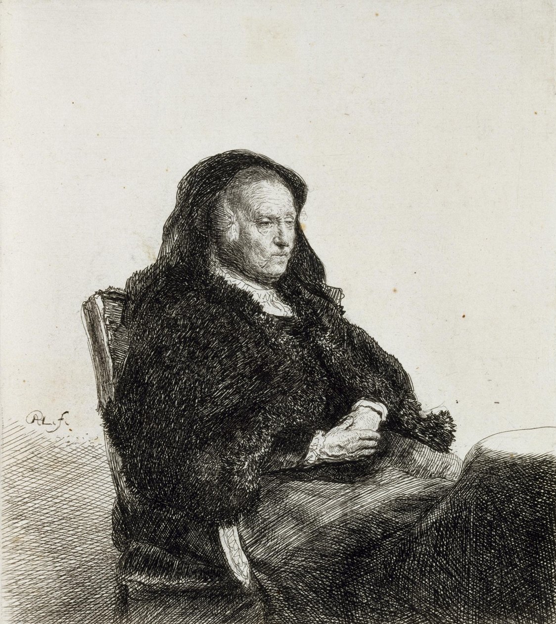 Die Mutter des Künstlers an einem Tisch sitzend von Rembrandt van Rijn