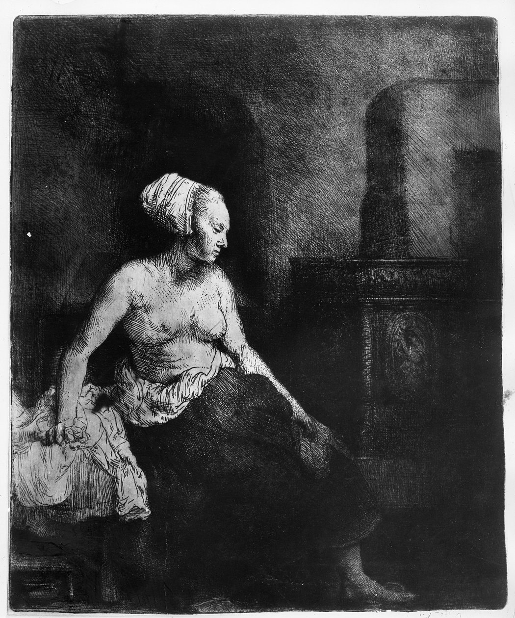 Frau sitzt halbnackt neben einem Ofen, 1658 von Rembrandt van Rijn