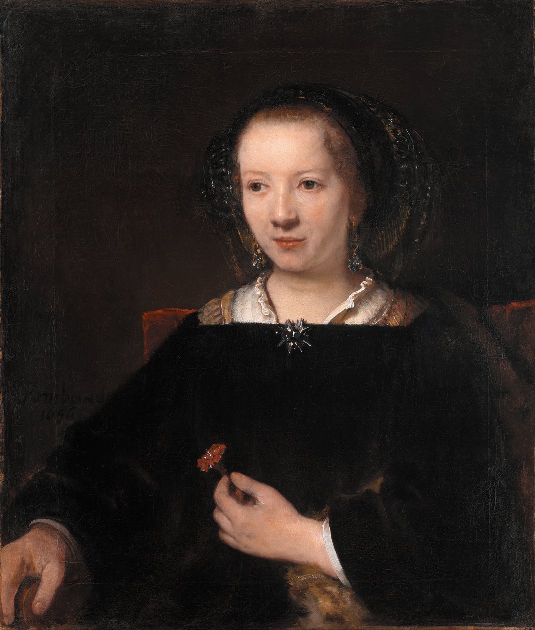 Junge Frau mit einer Nelke von Rembrandt van Rijn