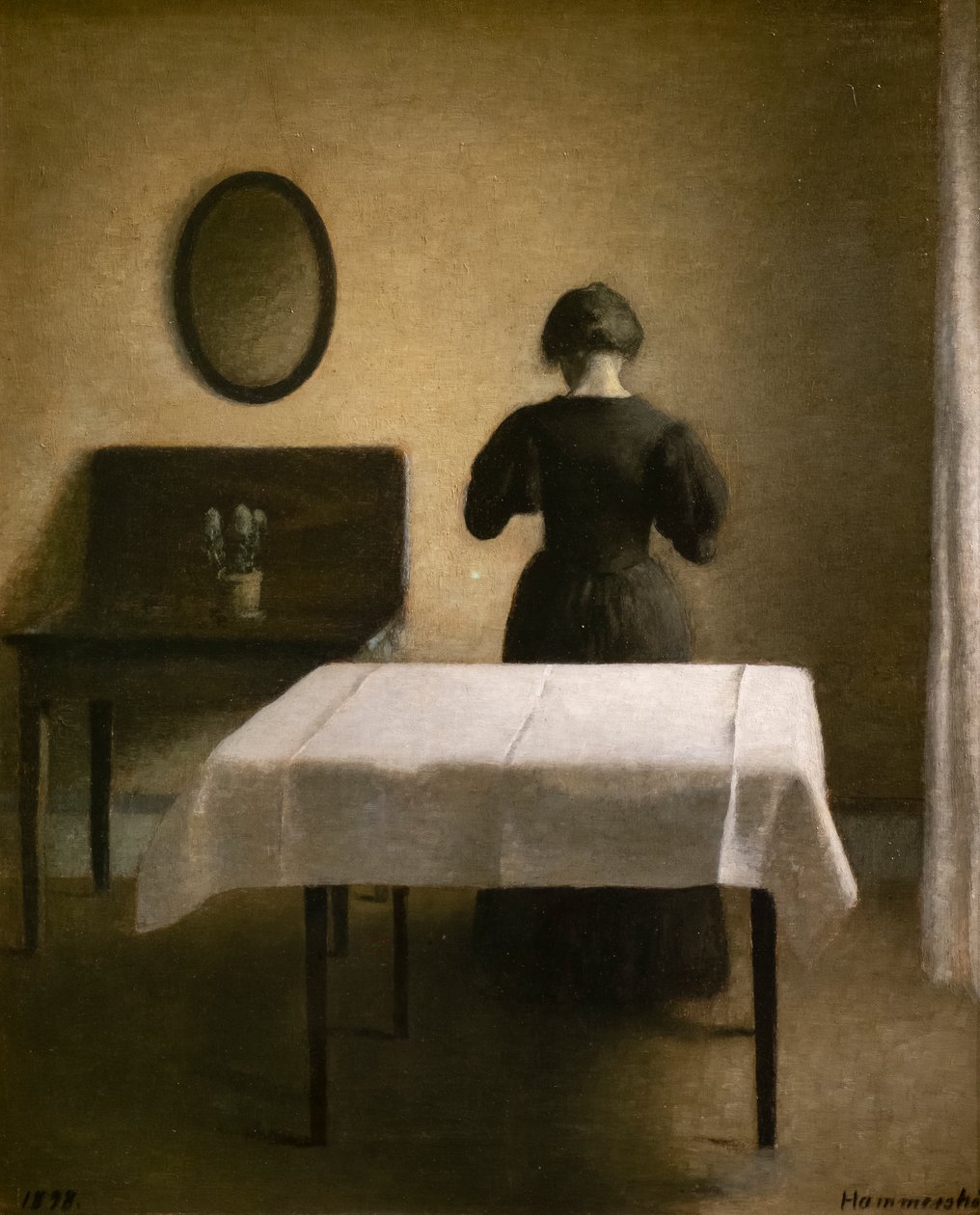 Innenraum mit einer schwarzen Frau von Vilhelm Hammershoi