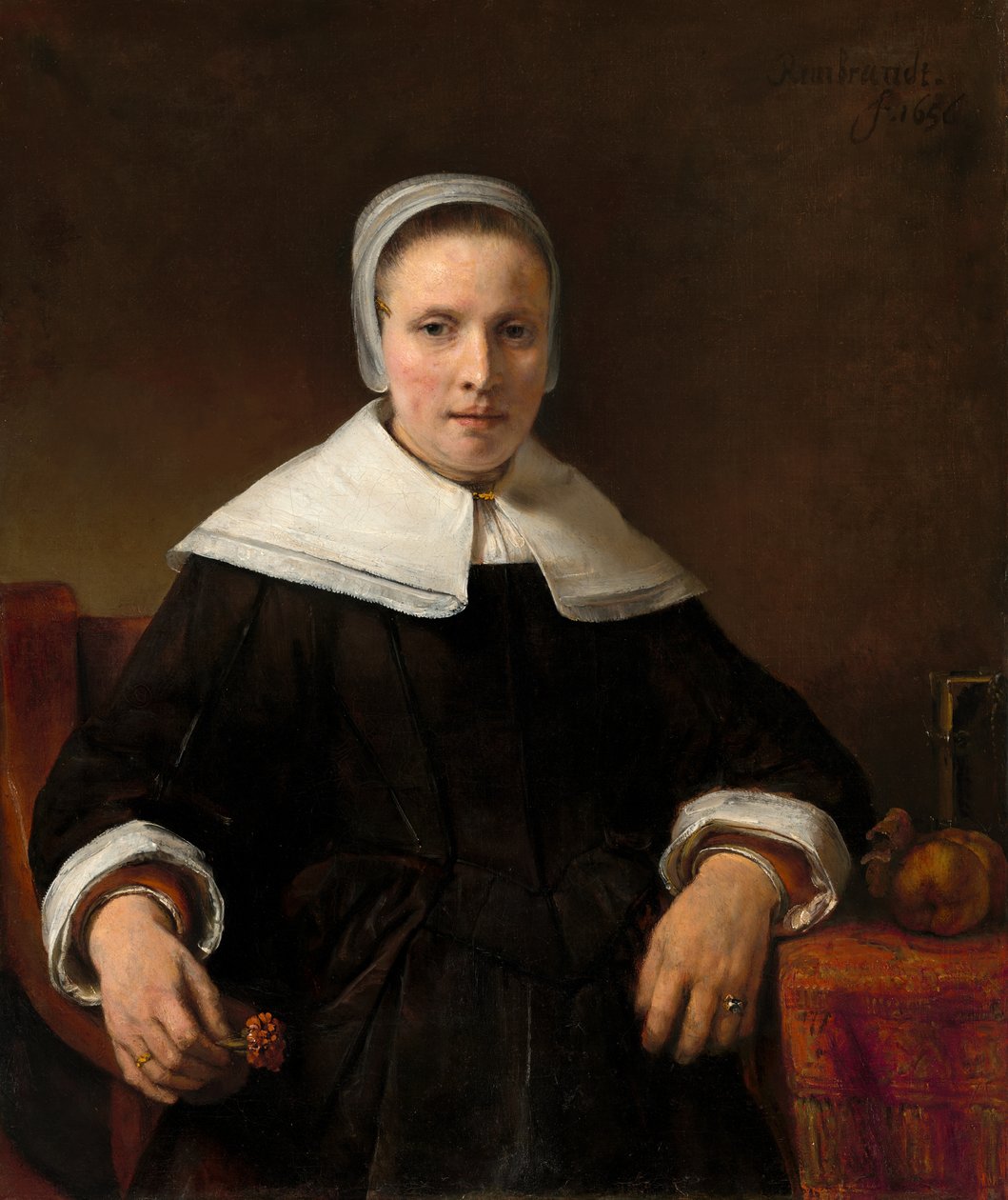 Eine Frau, die eine Nelke hält von Workshop of Rembrandt