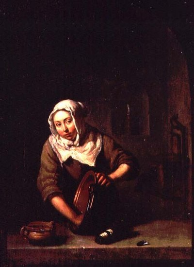 Frau beim Putzen von Caspar Netscher