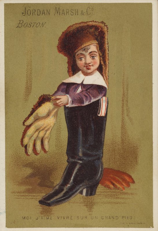 Junge steht in Erwachsenenstiefel von American School